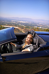 Image showing Woman, relax and drive in sports car for road trip in summer or adventure on vacation in Beverly Hills. Luxury vehicle for speed on highway, transportation and mountain for journey or freedom.