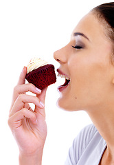 Image showing Studio, woman and cupcake with happiness for nutrition, eating muffin and unhealthy diet. Female person, food and sweet dessert with cake, snack enjoyment and satisfaction on white background