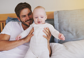 Image showing Family, love and father with baby in bedroom for bonding, relationship and care for parenting. Happy, home and dad playing with newborn infant for child development, support and affection in house