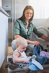 Image showing Laundry, washing and mother with baby in home for multitasking, housekeeping and housework. Family, parenting and mom with newborn in clothing basket for cleaning, hygiene and maintenance on floor