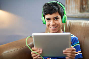 Image showing Tablet, portrait or boy with headphones on sofa for gaming, search or google it sign up at home. Digital, search and face of happy kid with app for elearning, streaming or educational, video or film