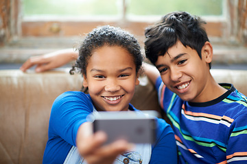 Image showing Children, smartphone and smile for selfie on sofa, family home and technology for streaming and playing entertainment. Internet, siblings together for social media post or happy kid memories