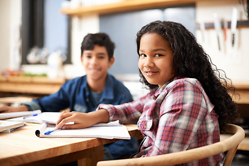 Image showing School students, friends and portrait with homework education in class together, assignment or teamwork. Boy, girl and face at desk for creative writing with paperwork project, knowledge or classroom