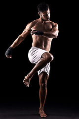 Image showing Man, boxer and fighter in studio for sports, fitness and warrior training on black background. Person, athlete and strong muscles for workout or exercise, health and ready for battle or competition