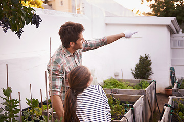 Image showing Father, daughter and gardening with pointing in home for bonding, happy family and curious child. Man, girl kid and learning with sustainability, agriculture and plant growth in backyard of house