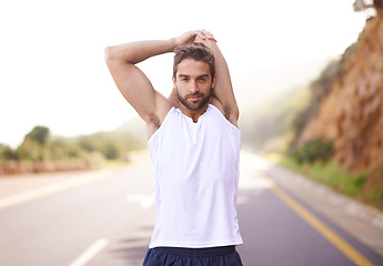 Image showing Road, workout and stretching of man, smile and training for energy in nature of city of Cape Town. Adult, male person or runner ready for sport with exercise to relax, wellness and healthy for body