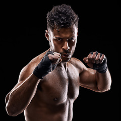 Image showing Boxing, fitness and portrait of man with hands for sport, exercise and workout isolated in black background. Male person, athlete and boxer in studio backdrop for wellness, training and health