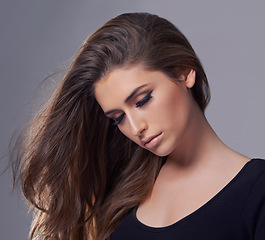 Image showing Aesthetic, hair care and woman with beauty, wellness and treatment on a grey studio background. Confidence, person and model with shampoo and keratin with texture and cosmetics with shine and glowing