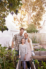 Image showing Portrait, garden and family with vegetables, agriculture and smile with happiness and sustainability. Parents in a kitchen, outdoor and mother with father and girl with nature, farm and organic food