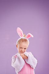 Image showing Portrait, rabbit and girl with costume, happy and Halloween outfit on a purple studio background. Face, kid and model with bunny clothes and character with holiday and easter with culture and funny