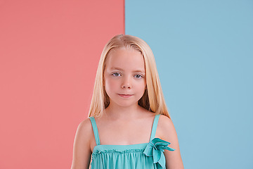 Image showing Girl, portrait and sad for growth in studio, child development and disappointment. Female person, kid and unhappy or upset for childhood on backdrop, negative attitude and color block background