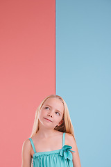 Image showing Thinking, mockup and girl child in studio with brainstorming, ideas or memory facial expression. Planning, question and young kid model with guess, decision or choice face by color block background.