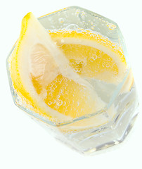 Image showing glass with soda water and lemon slices 