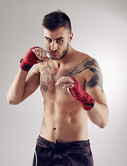 Image showing Fist, MMA and portrait of male fighter for martial arts, boxing and angry on white background. Hands, athlete and exercise for man kickboxer, studio and training for impact sports competition