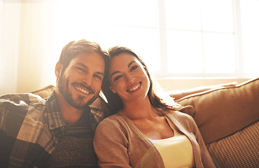 Image showing Love, happy and portrait of couple on sofa for bonding, loving relationship and relax together in home. Marriage, morning and man and woman on couch with smile, embrace and hugging in living room