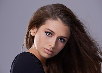 Image showing Hair, portrait and woman in studio for hairstyle, treatment and glow on isolated grey background. Shampoo, confident and face of female model with beauty cosmetics, salon and volume in mockup space