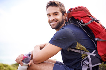 Image showing Man, hike and smile for adventure with water bottle or backpacker for fitness, workout and activity on mountain top. Portrait, happy and outdoor in nature for healthy mind in woods or forest.