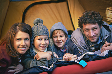 Image showing Portrait, happy family and camping in tent on holiday, vacation or travel together. Face, parents and smile of children at campsite for kids bonding to relax with mother and father on adventure trip