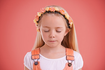 Image showing Fashion, flower crown and girl child in studio with casual, trendy and cute outfit with calm face. Peace, stylish and young kid model with cool style and floral headband isolated by pink background.