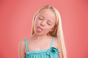 Image showing Silly, funny and girl with expression for prank, mischief and fun in childhood isolated in studio background. Female child, gen z kid and tongue out for joke, cheerful and goofy or playful face