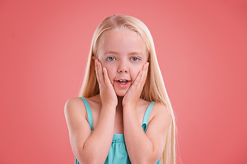 Image showing Wow, children and girl with hands on face in studio for news, information or promo on pink background. Omg, surprise and female kid model with shock emoji for announcement, deal or giveaway offer