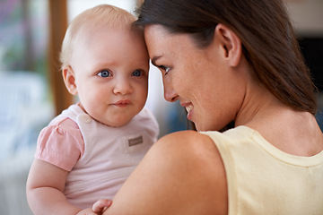 Image showing Family, home and mother with baby hug for bonding, relationship and care for motherhood. Love, parenting and happy mom carrying newborn infant for child development, support and affection in house