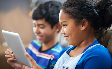 Image showing Children, tablet and happy with smile on sofa, family home and technology for streaming and playing entertainment. Internet, siblings together and elearning for child development or online games