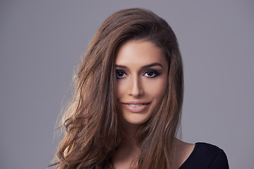Image showing Haircare, portrait and woman in studio for hairstyle, treatment and glow on isolated grey background. Shampoo, smile and face of female model with natural cosmetics, salon and volume in mockup space