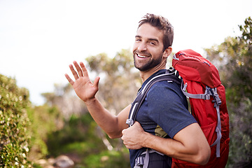 Image showing Man, hike and happy with wave for adventure with backpack for fitness, workout and hobby in Canada. Portrait, smile and outdoor activity in nature for healthy mind in woods on summer holiday.