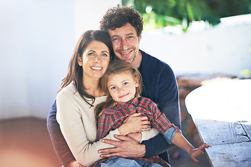 Image showing Happy family, portrait and relax in garden of home with embrace, summer holiday and weekend break. Parents, girl child and face with smile in backyard of house with healthy relationship, love or care