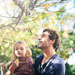 Image showing Father, daughter and smile in garden in autumn with trees, leaves and curious for ecosystem and environment. Family, man and girl child with happiness in backyard of home for bonding, nature or relax