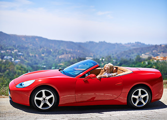 Image showing Woman, relax and summer in sports car for road trip or adventure on vacation or holiday in Beverly Hills. Luxury vehicle for speed on highway, transport and drive on mountain for journey or freedom.