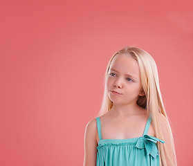 Image showing Girl, kid and thinking on growth in studio, child development and ideas on pink background. Female person, planning and confidence for childhood on mockup space, contemplating and innocent ponder