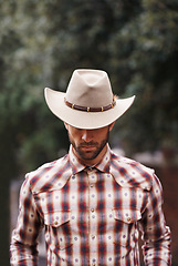 Image showing Cowboy, hat and man for fashion, farmer and clothes for western and ranch in Texas for rodeo on mockup. Young person and serious with checkered shirt and attractive for culture, style and trend