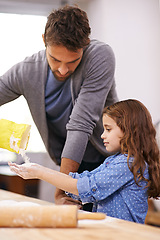 Image showing Father, kitchen and child hands baking, helping and dough with flour on counter table, parent together and smile. Family home, cooking activity and fun bonding for meal preparation with utensil