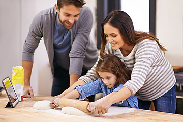 Image showing Cooking, pizza and family in kitchen with tablet for recipe, guide and mom and dad learning with child. Teaching, baking and girl helping parents with rolling pin in home and together for dinner