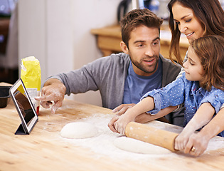 Image showing Learning, cooking and family in kitchen with tablet for recipe, guide and mom and dad with child in home. Baking, pizza and parents helping girl with rolling pin and talking about dinner meal prep