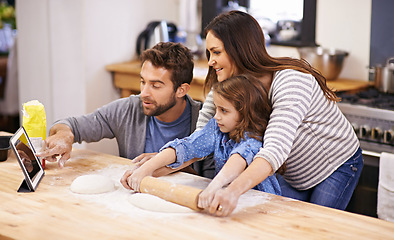 Image showing Family, learning and cooking in kitchen with tablet for recipe, guide and parents with child in home. Baking, mom and dad helping girl with rolling pin and talking about pizza, dinner or meal prep