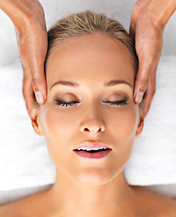 Image showing Resort, closeup or woman in head, massage or mental health as self care, relax or luxury wellness. Retreat, girl or hand in spa, therapy or zen of clinic, sleeping or peace on cosmetology table