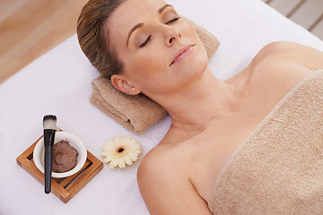 Image showing Woman, face and top view for facial at spa, massage and wellness with calm for zen and self care. Cosmetics, beauty and brush with paste for mask, relax and peace at luxury resort with treatment