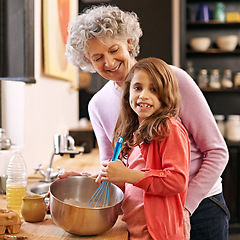 Image showing Baking, mix or portrait of grandmother with child in kitchen teaching a recipe for support or learning in home. Family, cooking or girl with bowl, grandma or senior woman for dinner, supper or lunch