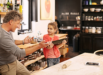 Image showing Cooking, learning or grandfather with child in kitchen teaching a recipe for support or helping in the home. Family, baking or girl with tray, grandpa or senior man for dinner, supper or lunch meal