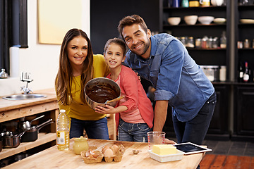 Image showing Parents, girl and portrait for baking with love, ingredients for cake or dessert with support and handmade with care. Mom, dad and kid together in kitchen for bonding or teaching with affection.