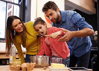 Image showing Parents, girl and kitchen for baking with love, ingredients for cake or dessert with support and handmade with care. Mom, dad and kid with wow face for mixture with bonding or teaching with affection