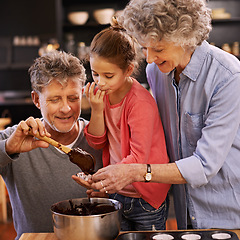 Image showing Teaching, baking and grandparents with girl, smile and ingredients with help and bonding together. Family, senior man or old woman with grandchild, happy or utensils with recipe or hobby in a kitchen