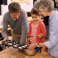 Image showing Child, grandparents and baking with cupcakes, kitchen and bonding together. Mature woman, smile and girl with happiness, love and learning at home with grandmother for childhood memories and family