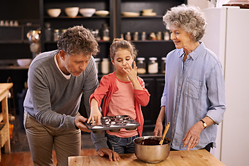 Image showing Girl, grandparents and baking with cupcakes, kitchen and bonding together. Mature couple, smile and child with happiness, love and learning at home with grandmother for childhood memories and family