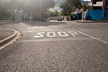 Image showing Road marking, street and stop sign with mistake for humor, joke or comic text for soup in neighborhood. Asphalt, error and funny signage with writing, language and wrong spelling for warning in town