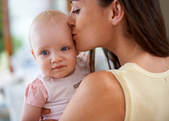 Image showing Family, kiss and mom with baby in home for bonding, relationship and care for motherhood. Happy, parenting and mother carrying newborn infant for child development, love and affection in house