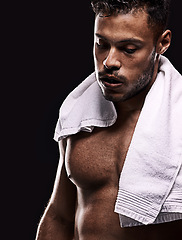 Image showing Fitness, towel and tired man in studio for intense training, challenge or body workout on black background. Breathing, face and male bodybuilder with sports, fatigue or workout pause for recovery